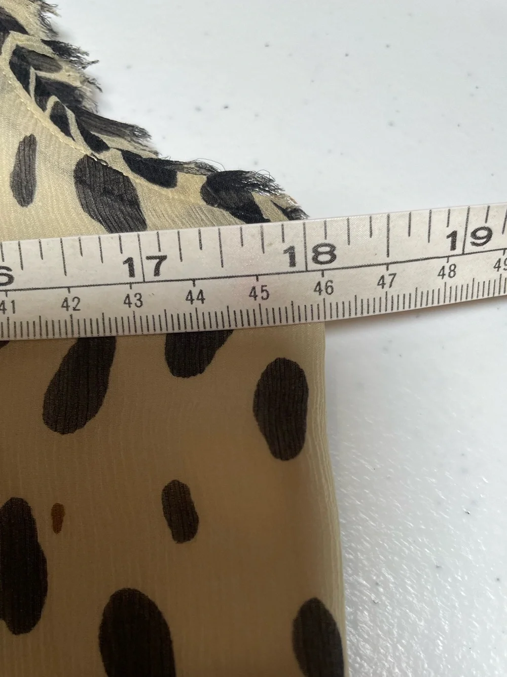J.Crew silk blouse features a sleeveless design and a cheetah print. Size 2.